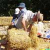 people with straw bales