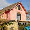Sun shining on the straw bale house